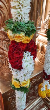 Bangalore, Karnataka, India-Oct 18, 2020: Closeup of Marriage hall decorated with colorful garland and hindu tamil traditional puja arrangement.