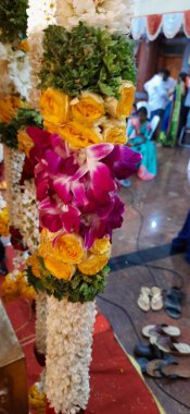 Bangalore, Karnataka, India-Oct 18, 2020: Closeup of Marriage hall decorated with colorful garland and hindu tamil traditional puja arrangement.