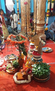 Bangalore, Karnataka, India-Oct 18, 2020: Closeup of Marriage hall decorated with colorful garland and hindu tamil traditional puja arrangement.