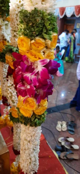 Bangalore, Karnataka, India-Oct 18, 2020: Closeup of Marriage hall decorated with colorful garland and hindu tamil traditional puja arrangement.