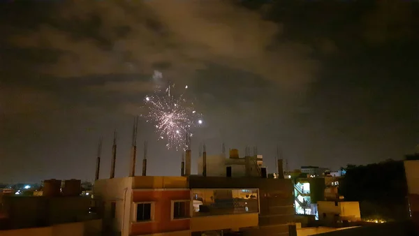 Closeup of beautiful fireworks lighting the night sky in Bangalore city during Diwali Festival Celebration