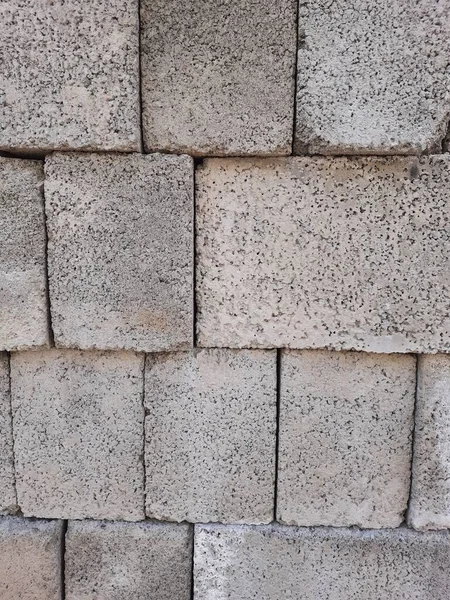 Closeup of grey color concrete or cement block wall texture background.