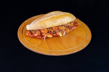 burger and meat on a dark background.