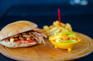 Chicken doner kebab in bread. french fries. selective focus