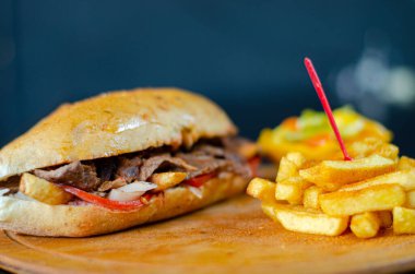 Meat doner kebab in sandwich bread. Traditional Turkish cuisine delicacies. Selective focus.