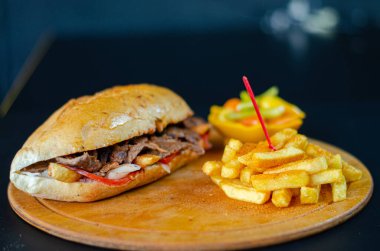 Meat doner kebab in sandwich bread. Traditional Turkish cuisine delicacies. Selective focus.