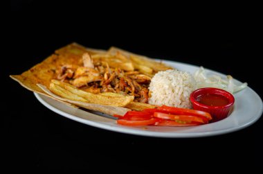 Chicken doner in plate. Chicken doner in porcelain plate isolated on black background. Delicious Turkish food doner. selective focus