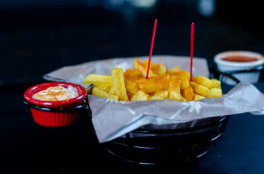 Fried potato chips in a basket. selective focus