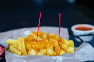 Fried potato chips in a basket. selective focus