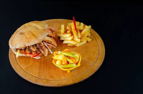 Chicken doner kebab in bread. french fries. selective focus