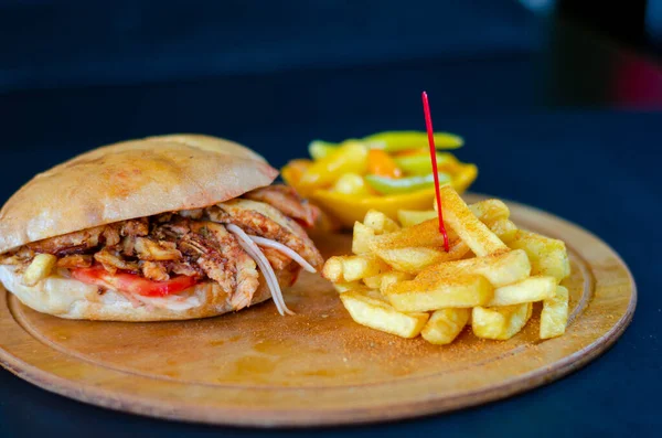 Chicken doner kebab in bread. french fries. selective focus