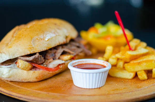 Meat doner kebab in sandwich bread. Traditional Turkish cuisine delicacies. Selective focus.