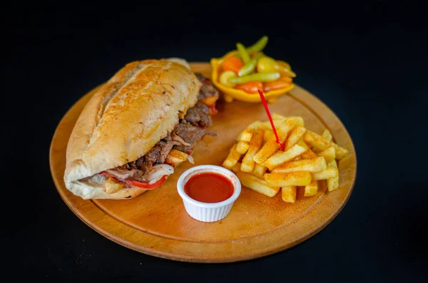 Meat doner kebab in sandwich bread. Traditional Turkish cuisine delicacies. Selective focus.