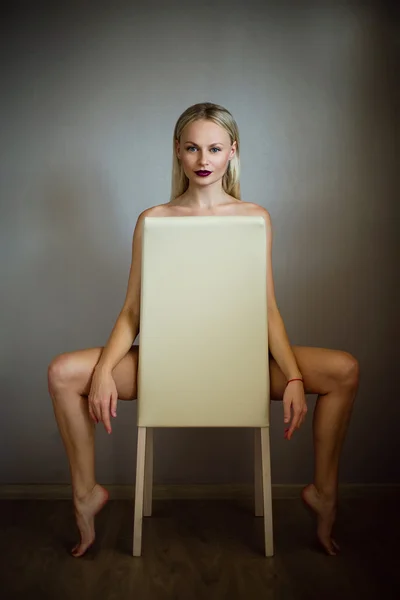 Nude beautiful woman on chair