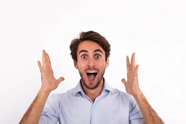 Studio shot portrait of young man surprised expression isolated on white background. — стоковое фото