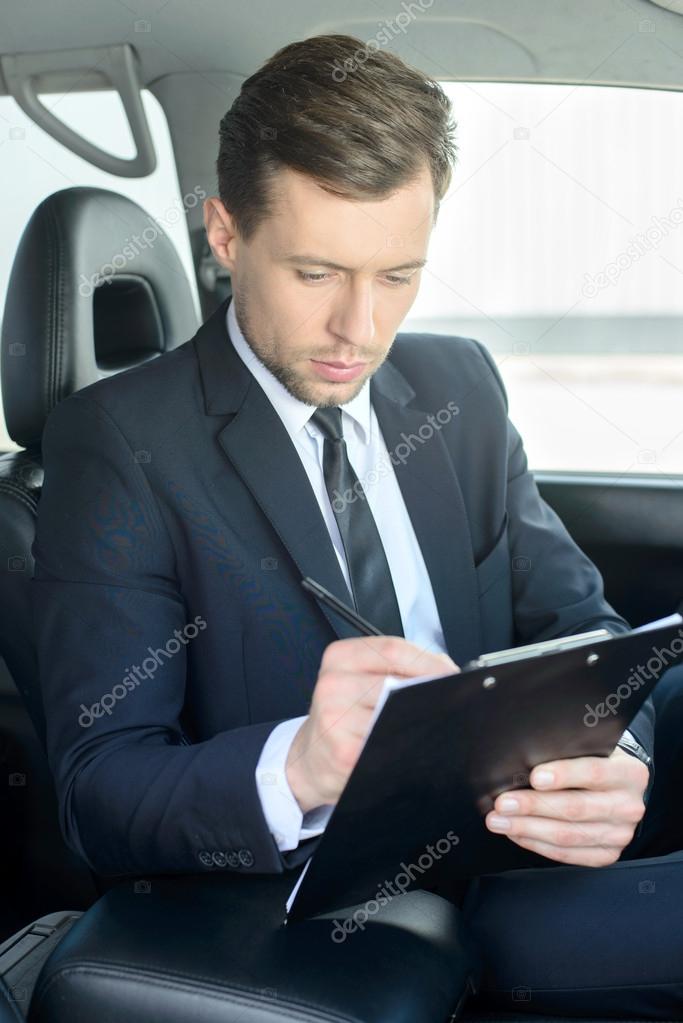 Businessman In The Car