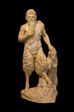 Small marble statue of Pan, god of the shepherds and hunting, follower of Dionysus. He is shown playing the syrinx, a musical instrument made or reed. Isolated on black background clipart