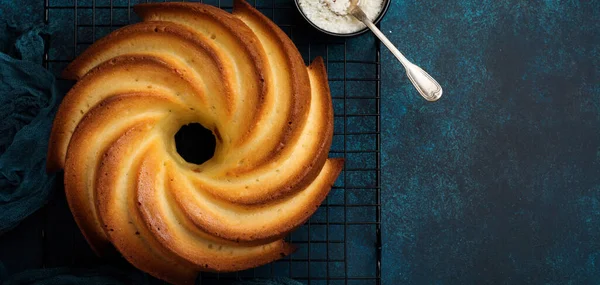 Bundt Cake Sugar Glaze Coconut Dark Blue Old Concrete Background — Stock Photo, Image