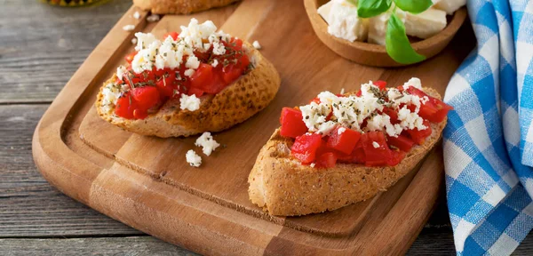 Bruschetta Tomatoes Feta Cheese Basil Traditional Greek Snack Wooden Background — Stock Photo, Image