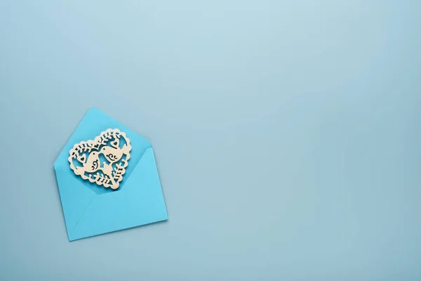 Pink Envelope White Openwork Heart Light Blue Background Top View — Stockfoto