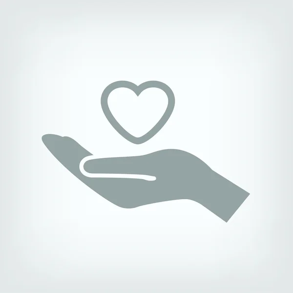Coração na mão ícone — Vetor de Stock