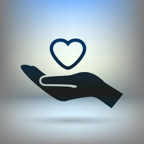 Heart in hand icon — Stock Vector