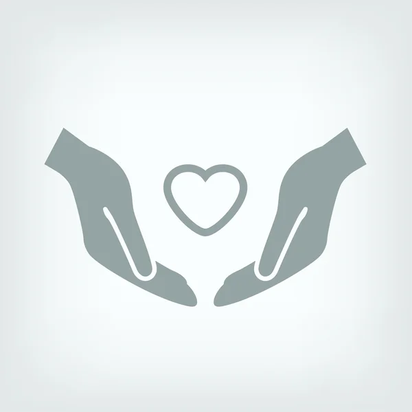 Heart in hands icon — Stock Vector