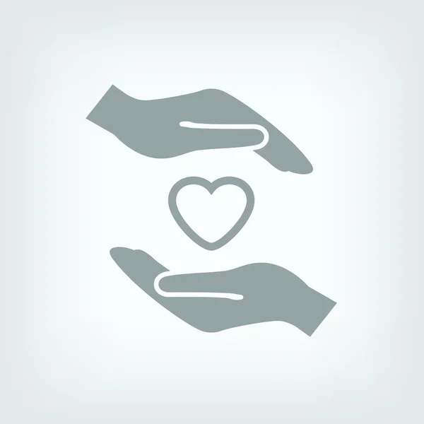 Heart in hands icon — Stock Vector