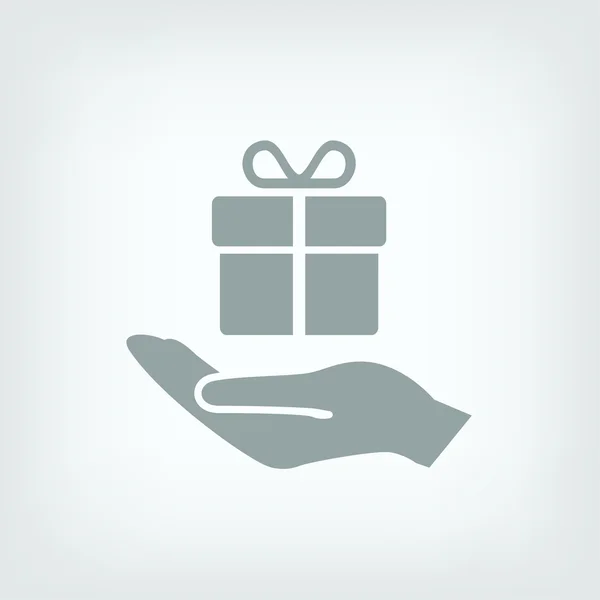 Gift in hand icon — Stock Vector