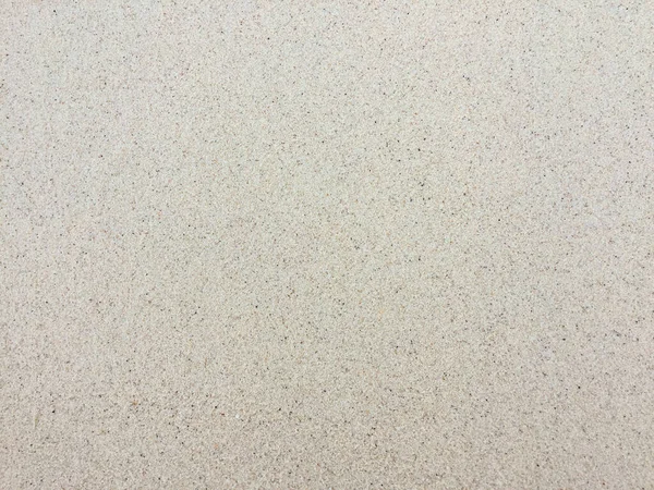 Sahildeki beyaz kumların arka planı ve dokusu. Kum deseni.