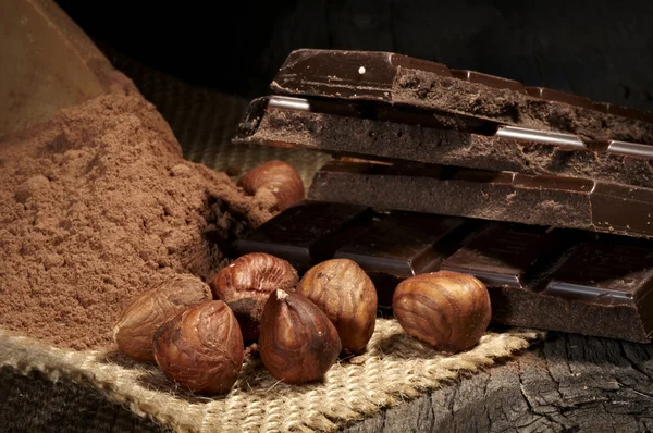 Chocolate with nuts and cocoa — Stock Photo, Image