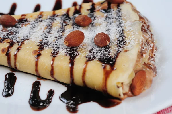 Crepes with chocolate syrup — Stock Photo, Image