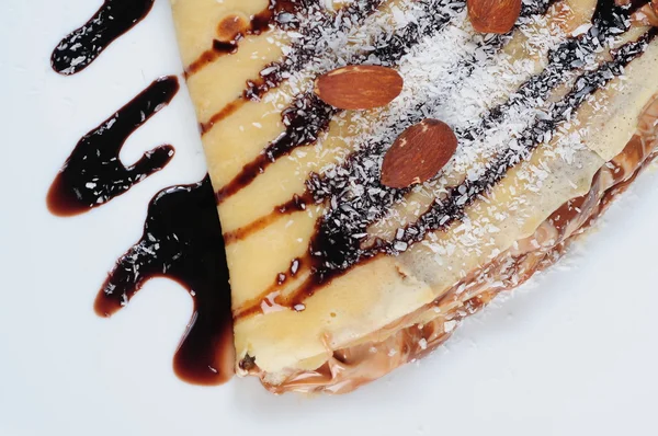 Crepes with chocolate syrup — Stock Photo, Image