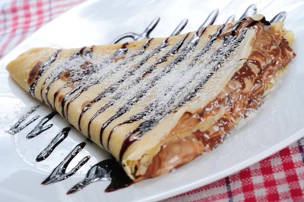 Pancake with chocolate syrup — Stock Photo, Image