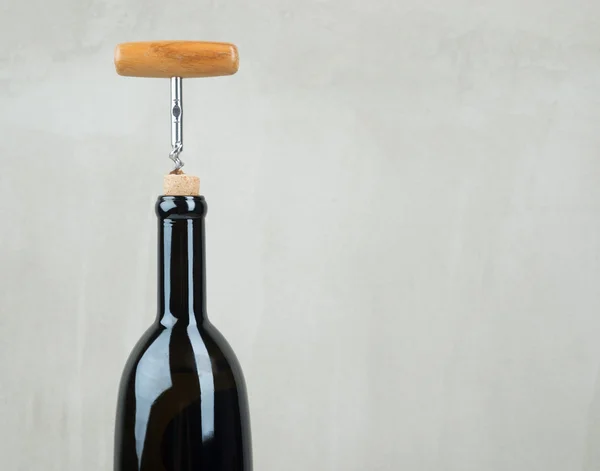 Bottle of wine with corkscrew — Stock Photo, Image