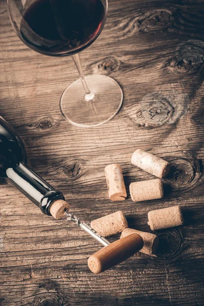 Bottle of wine with corkscrew — Stock Photo, Image