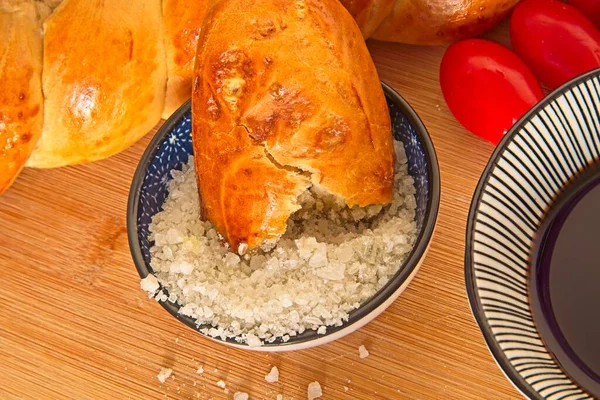 Bread on coarse Atlantic salt alongside olive oil and balsamic vinegar, first course appetizer — Zdjęcie stockowe