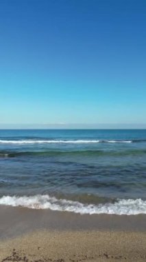 Sea waves gently crash on the beach coast. Givat Alia, Jaffa, Israel. High quality 4k footage