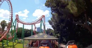 Tel Aviv, Israel - July 13, 2022: Tel Aviv amusement park, Luna Park, POV shot of twisting roller coaster. High quality 4k footage