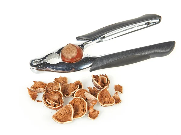 Nutcracker tool and hazelnuts — Stock Photo, Image