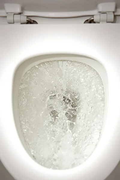 Flushing toilet — Stock Photo, Image