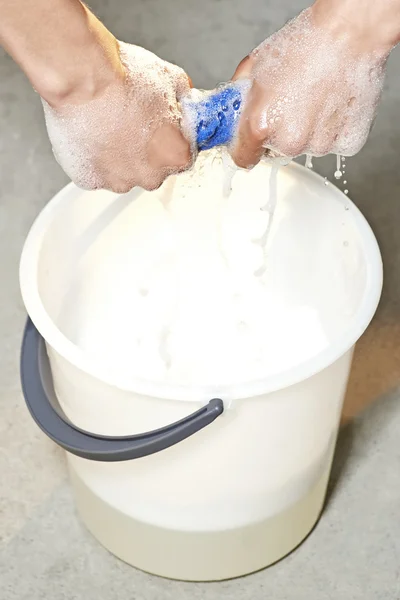 Wringing a cleaning cloth — Stock Photo, Image