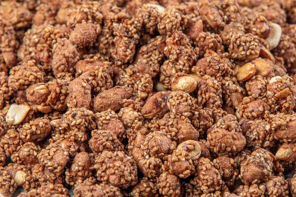 Close-up view of brown colored peanuts and peanut collection. Concept groundnuts and Sesame, Sesame seeds.