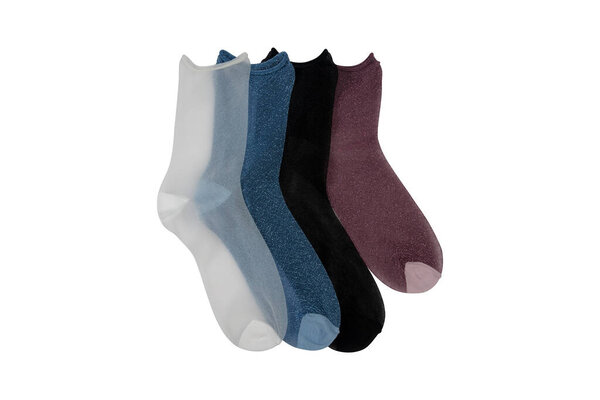 Clothes made of socks, knitwear. Many colorful socks in the form of a panorama. Socks of different sizes for cold seasons. Clothing for autumn and winter. Knitted socks on a white background.