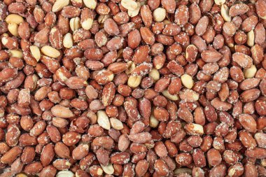  Kızarmış fıstık arka planı. Kızarmış tuzlu fıstığın kusursuz deseni. Yakın plan. Yukarıdan görüntüle.