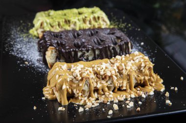 Belgian waffles with strawberries, ice cream and chocolate, Plate of belgian waffles on dark background. Selection of Belgian Waffles.