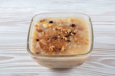 Traditional Turkish dessert called Aure also known as Ashura, Asure or Ashure or Noahs Pudding. Healty meal with dried fruits, walnut and pomegranade. 