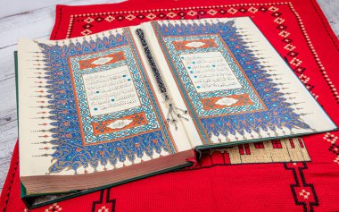 Istanbul Turkey 11 February 2022; Quran and tasbih on prayer rug. Islamic concept, The holy Quran on a praying matt . 