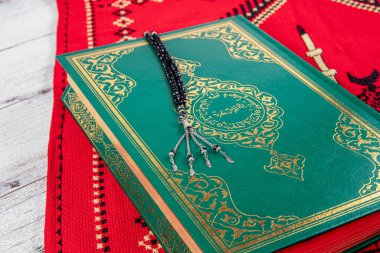 Istanbul Turkey 11 February 2022; Quran and tasbih on prayer rug. Islamic concept, The holy Quran on a praying matt . 