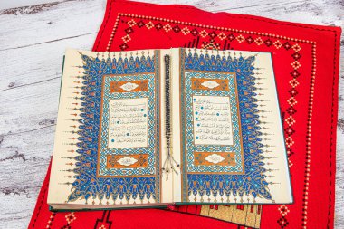 Istanbul Turkey 11 February 2022; Quran and tasbih on prayer rug. Islamic concept, The holy Quran on a praying matt . 